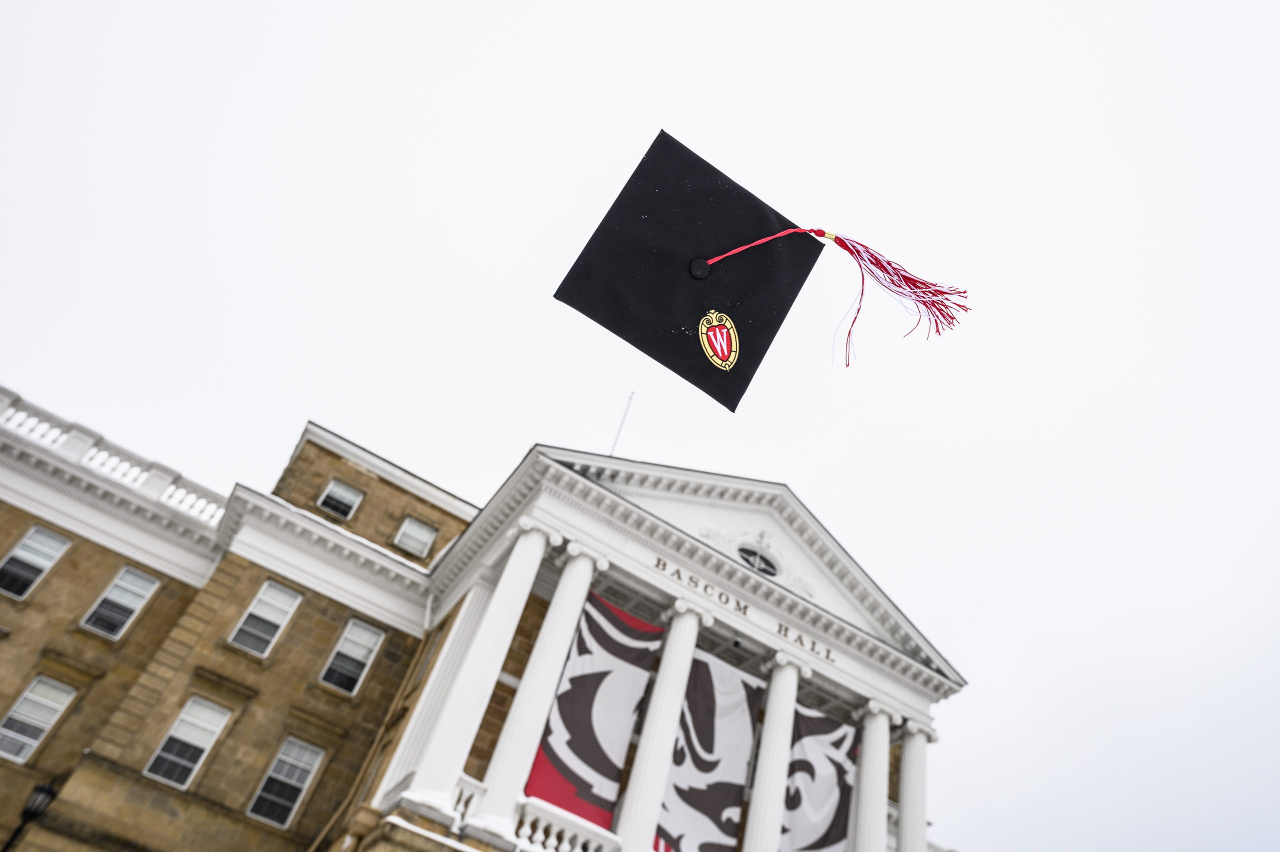 Commencement cap tossed in the air