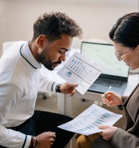 Man and woman looking at paper
