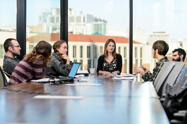 Students and instructor at table