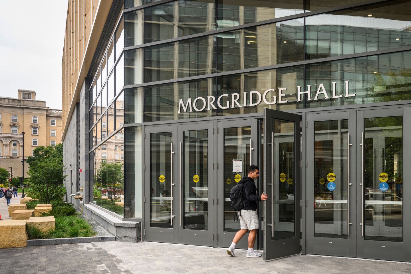 Person entering Morgridge Hall